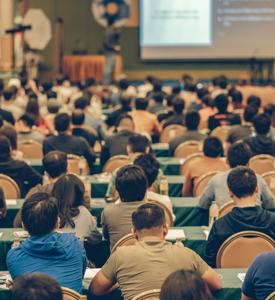 rear-view-of-audience-in-the-conference-hall-or-seminar-meeting-which-have-speakers.jpg